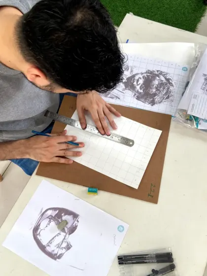 Using the grid method, this student is tackling a complex architectural sketch with confidence.