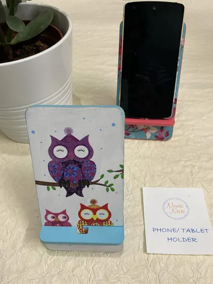 This owl-themed phone stand is a cute and practical accessory for your desk.