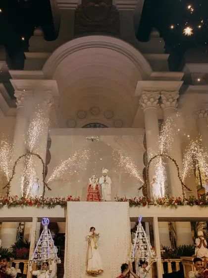 A grand wedding moment for Tushar and Samta with fireworks lighting up the palatial venue. This captures the celebratory spirit of a lavish destination wedding.