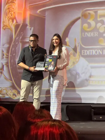 Another shot from the stage, holding the award that represents so much of my passion and dedication.
