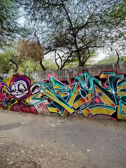 A wide shot of a wall painted with my crew. You can see different styles side-by-side, from characters to complex lettering.