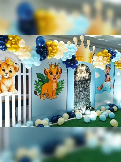 A detail shot of the Lion King backdrop, highlighting the silver sequin panel and the cute Simba character's peeking out. The balloon's on the floor add an extra layer of fun for the kids.
