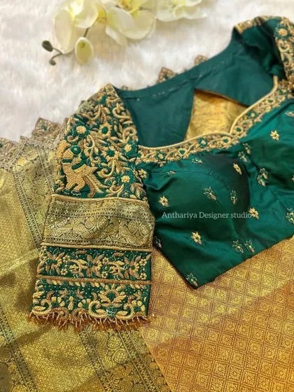 A detailed shot of the sleeve, featuring traditional motifs like elephants and peacocks.