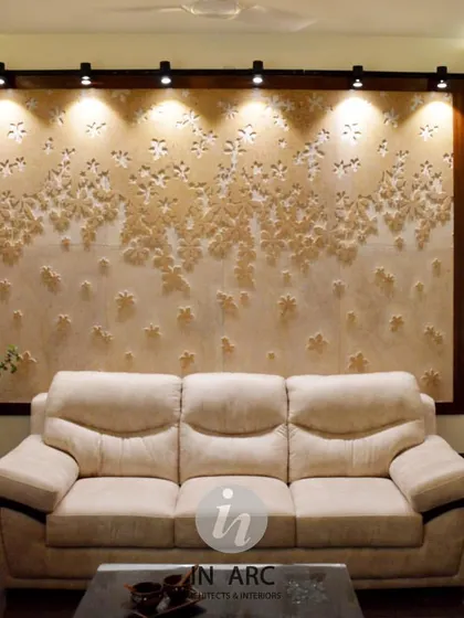 "Everything is designed. Few things are designed well." This living area features a custom CNC-carved stone panel, spot-lit to create a dramatic and artistic backdrop for the main seating area.