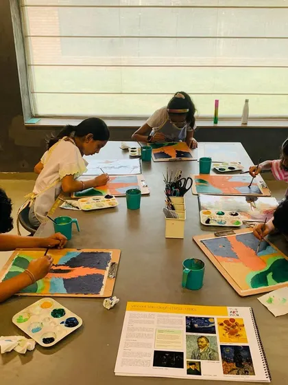 A full view of the class working on their Van Gogh landscapes, each interpreting the style in their own way.