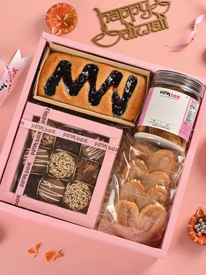 Inspired by the joy of indulgence, our 'Anand' hamper includes a Blueberry Marble cake, assorted truffle balls, savory garlic toasties, and French Hearts.