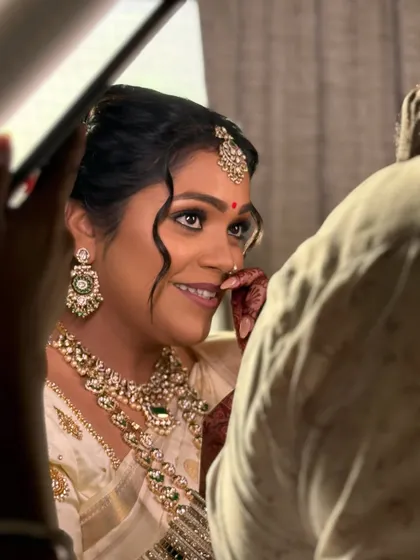 A candid shot capturing the bride's happy tears and glowing smile. My makeup is designed to be long-lasting and tear-proof, ensuring you look perfect through all the emotional moments of your big day.