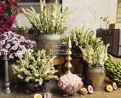 A beautiful welcome arrangement at the entrance, with brass pots filled with tuberoses and other flowers.