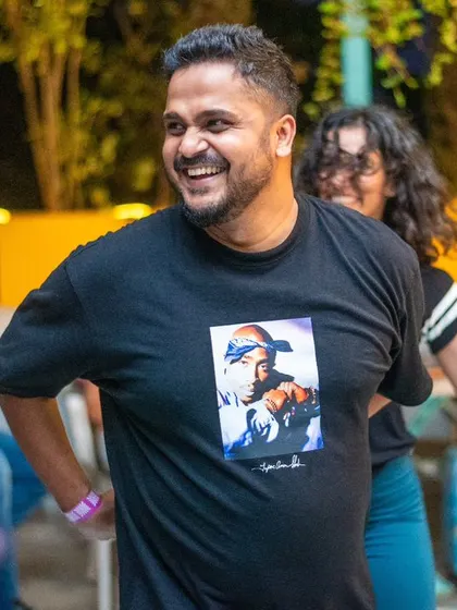 A happy and confident dancer enjoying his moment in the spotlight.