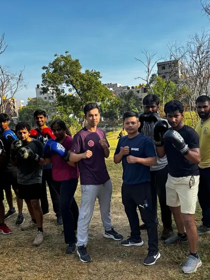 The group posing after a rewarding open-air boxing workout.
