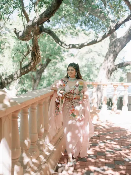 The bride looks ethereal in the soft sunlight, her braided hairstyle perfectly matching the dreamy, romantic setting.