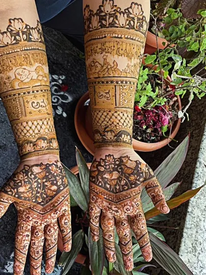 A unique design featuring a cute little cow and calf, symbolizing motherly love, making it perfect for a baby shower. The arms also have the names of the parents-to-be written in Kannada.