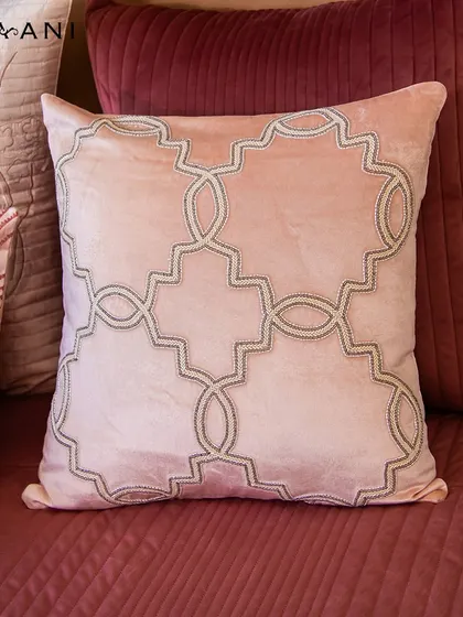Experience the artistry of exquisite Pipe Adda Work on my Lotus cushions. This pink velvet cushion, with its geometric beaded pattern, is a true piece of art that adds texture and sophistication.