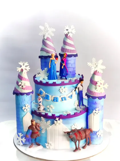 An Elsa and Anna castle cake. This design features the iconic ice palace and all the main characters from the movie.