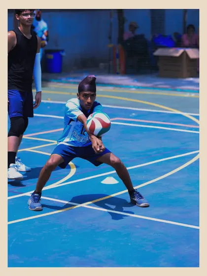 This player is in a low, athletic stance, ready to receive the ball. We teach our athletes to always be prepared and on their toes.