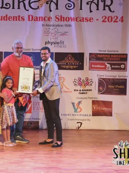 A family accepting an award on stage at the "It's Time to Shine" event.