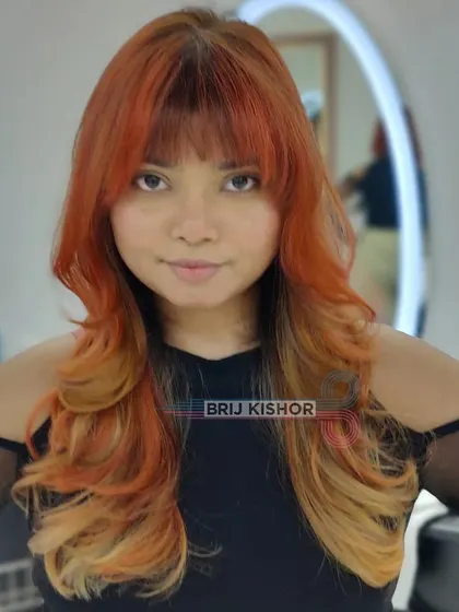 This Y2K look is all about patterns, colors, and creativity. The orange-to-blonde melt is a true statement.