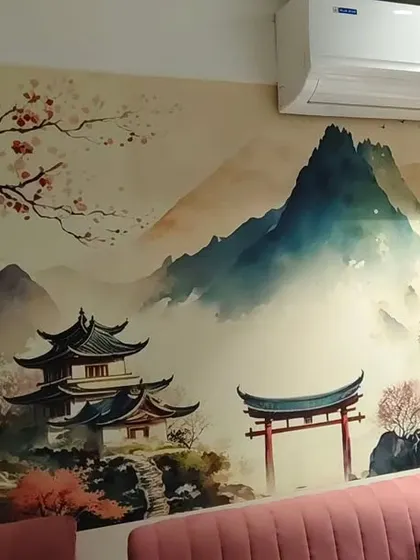 This Japanese-inspired landscape mural brings a sense of tranquility to the room. My installation ensures the delicate watercolor details and mountain scenery flow uninterrupted across the wall.