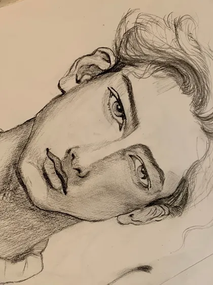 A student's pencil portrait sketch, capturing a quiet and expressive character. Our classes guide you to develop the skills needed to bring such characters to life on paper.