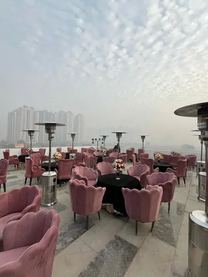 A panoramic view of the rooftop party setup, with the city skyline in the background, demonstrating our ability to transform any space.
