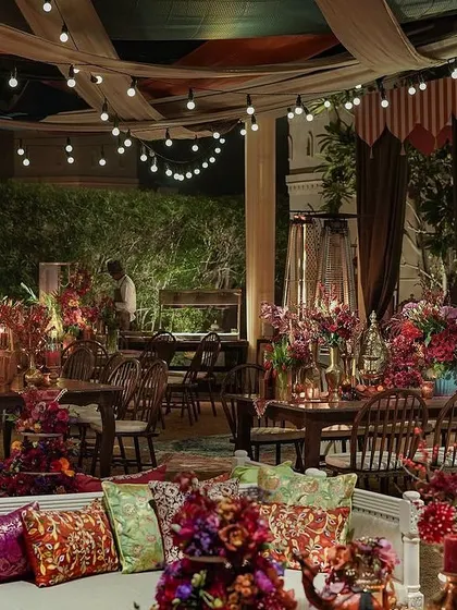 A wide view of the 'Bazaar' seating area, where rich textiles, warm lighting, and intricate decor details come together. The space was designed to feel authentic and vibrant, filled with the sights and sounds of a bustling marketplace.