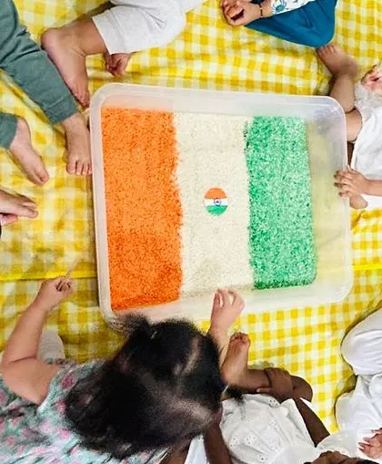 An overhead view of the tri-color sensory bin, a favorite activity during our Independence Day celebration.