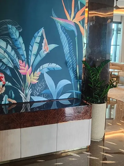 A wider shot showing the ZZ plant in a luxury bedroom setting, proving that even simple plants can look elegant in the right context.