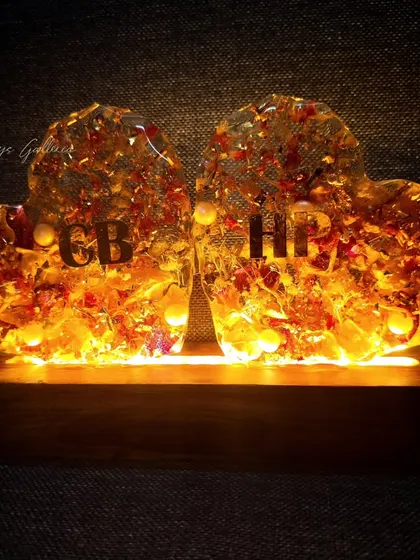 The double-heart lamp when lit, creating a warm and romantic glow.