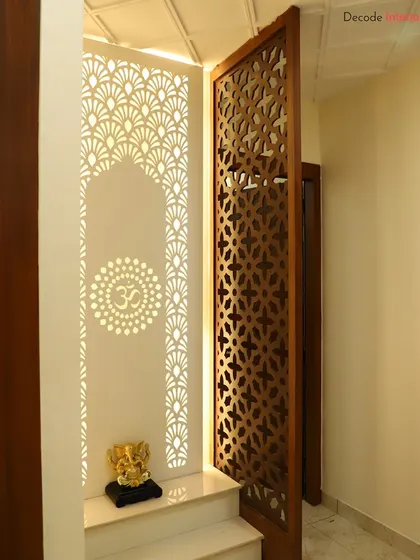 For me, a mandir is the spiritual heart of the home. This custom-designed pooja unit features intricate CNC-cut jali work on the doors and a backlit Corian panel with the 'Om' symbol, blending traditional motifs with modern aesthetics.