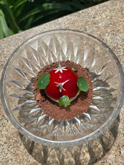 The goose liver bonbon presented in a crystal bowl, highlighting its jewel-like appearance.