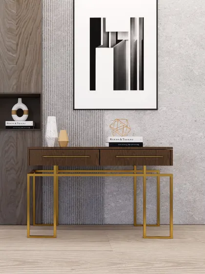 This console table combines a rich wood finish with a geometric gold base, creating a modern and sophisticated statement piece.