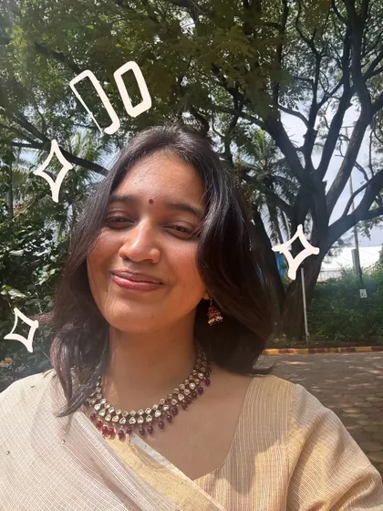 A happy, sun-drenched selfie in a traditional look, with some simple sparkle doodles.