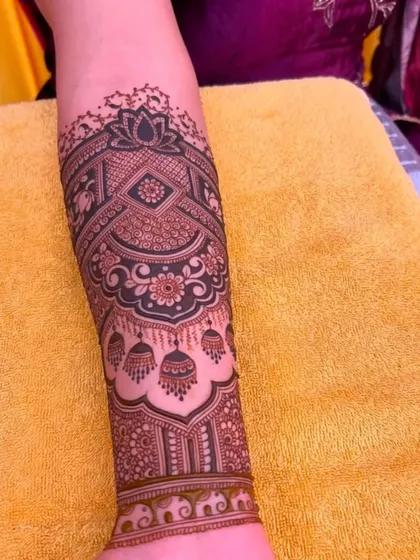 A beautiful armband design featuring jhumka (earring) motifs and a central lotus.