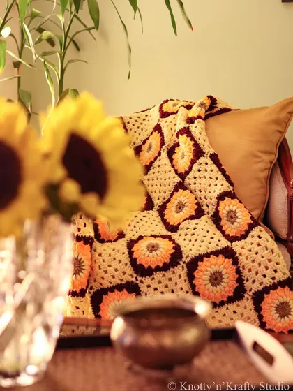 Throw season is just around the corner. This sunflower throw, seen here with fresh sunflowers, is the perfect way to welcome it.