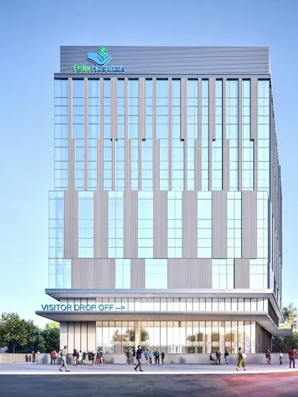 A frontal view of the Felix Hospital rendering, emphasizing its verticality and clean lines. The design brings together future-ready infrastructure and thoughtful planning to serve the Noida region.
