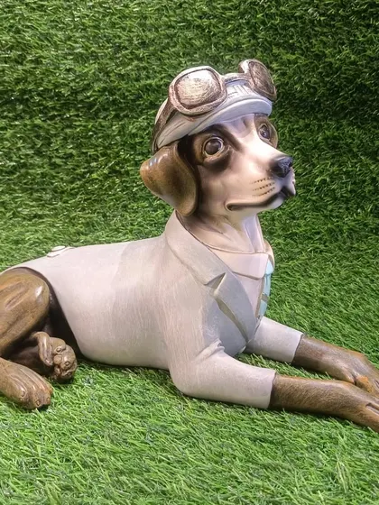 A beautifully crafted showpiece of a dog in a pilot's uniform. This whimsical and detailed figurine is perfect for dog lovers and collectors.