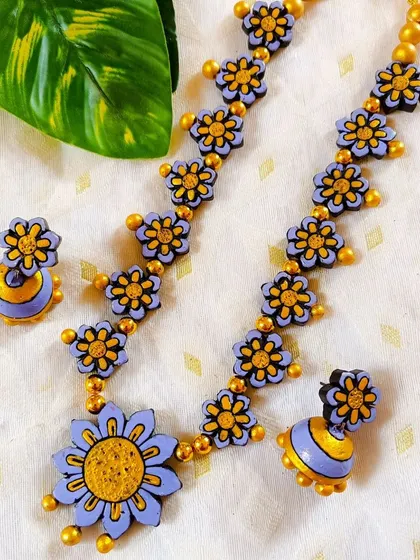 A beautiful lavender and yellow version of the floral necklace, a unique and modern color choice.