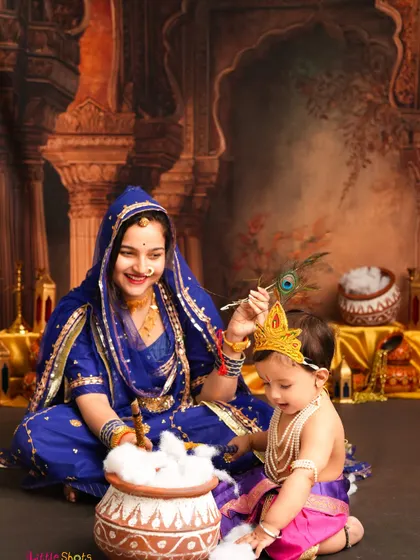 A playful scene with Yashoda and her mischievous little Krishna. He's caught red-handed with the pot of butter, creating a fun and classic Janmashtami moment.