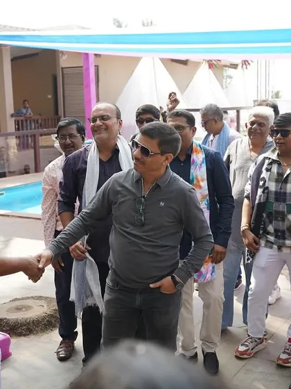 Engaging with the guests during a carnival party. I make sure to interact with everyone, not just the couple, to create an inclusive atmosphere.