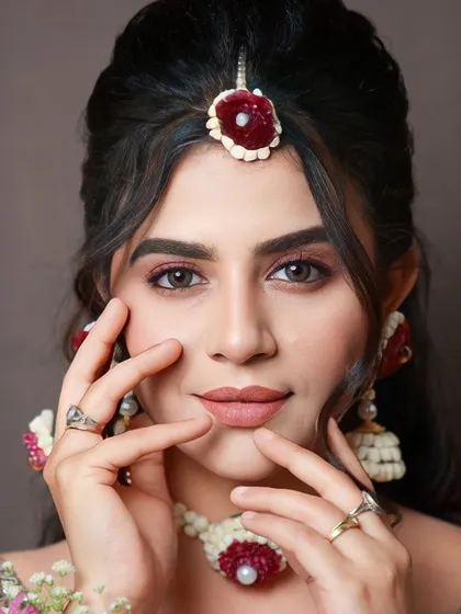 A final, confident pose from our model. My goal is to empower my students to create looks that make their clients feel this beautiful and self-assured.