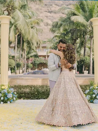A beautiful moment between the couple, Aashvi and Akash, during their Haldi ceremony. The decor, with its floral-lined pillars, provided a romantic and picturesque setting.