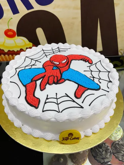 A 2kg Spider-Man cake with a hand-piped drawing of the hero in action.