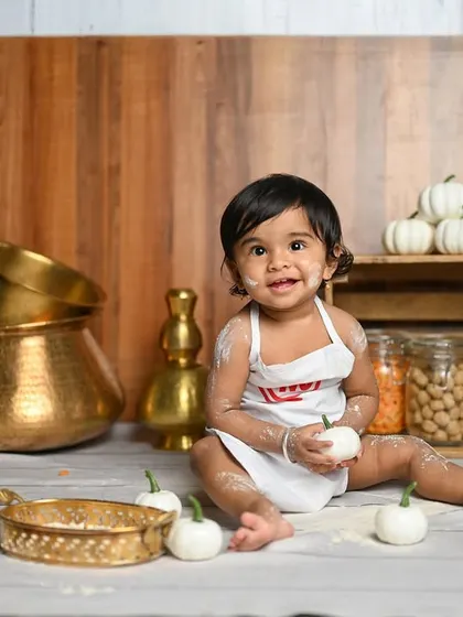 Let's get messy and have some fun! This 'Little Chef' theme is perfect for a first birthday or a fun toddler shoot. We use flour, little vegetables, and traditional kitchen props to create these adorable and playful pictures.