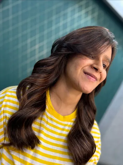 A new season refresh. This client is all smiles with her new brown color and soft, wavy style.