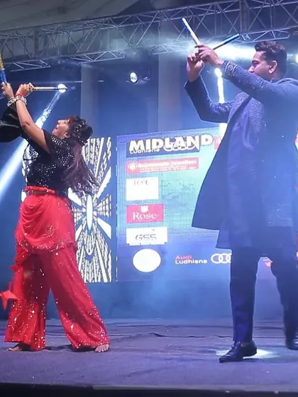 A performance shot from the 'City Dandiya Nite' by Radio City. My partner Urvashi and I are performing a high-energy Dandiya duet on the main stage.
