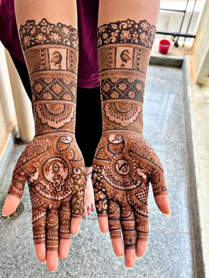 A custom design featuring the couple's initials, peacocks, and lovebirds. Every element is chosen to represent their love and commitment as they begin their new life together.