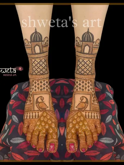 A classic bridal leg design with peacock and palace motifs. The pattern is clean and symmetrical, providing an elegant and traditional look that matches any bridal hand mehendi.