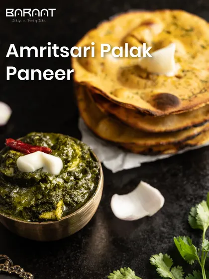 Our Amritsari Palak Paneer, served with a dollop of white butter and a side of makki di roti, is a hearty and wholesome North Indian classic.