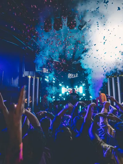 A dramatic shot with smoke and confetti at Flo.