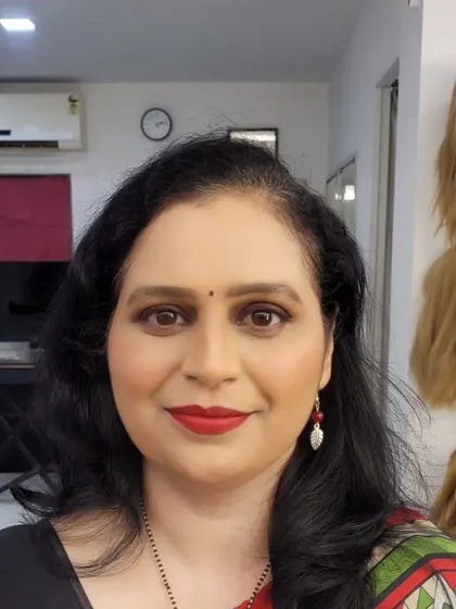A classic smokey eye with a bright red lip. This is a powerful and confident look that never goes out of style.